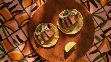 Tacos served on a hand-painted tile table